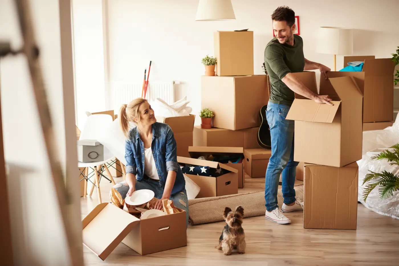 young-couple-new-apartment-with-small-dog